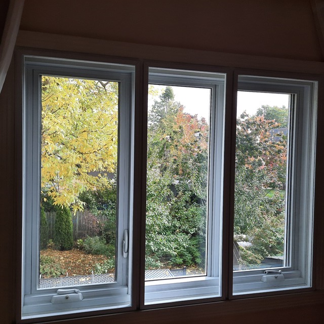 Bay windows, tree-lined street